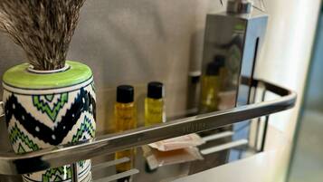 Shower, towels, soap, toilet paper