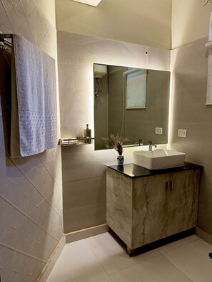 Shower, towels, soap, toilet paper