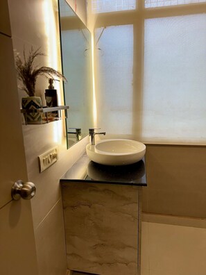 Shower, towels, soap, toilet paper