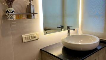 Shower, towels, soap, toilet paper