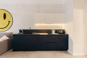 Microwave, coffee/tea maker, toaster, cookware/dishes/utensils