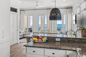 Enjoy meals in the kitchen with a dining area and ocean views.
