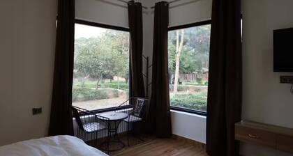 Spacious 5-bedroom farmhouse in cool Gurugram with AC, WiFi