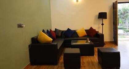 Spacious 5-bedroom farmhouse in cool Gurugram with AC, WiFi