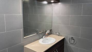 Shower, towels, soap, toilet paper