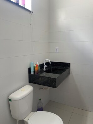 Shower, hair dryer, towels, toilet paper
