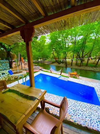 Seasonal outdoor pool. Gizli Cennet Villages Hotel