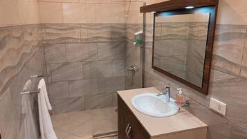 Shower, towels, soap, toilet paper
