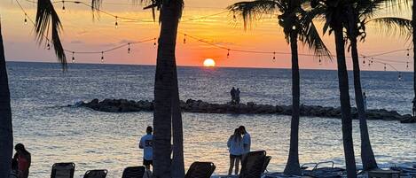 On the beach, sun-loungers, beach towels