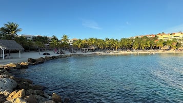 On the beach, sun-loungers, beach towels