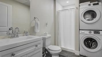 Shower, hair dryer, towels, soap