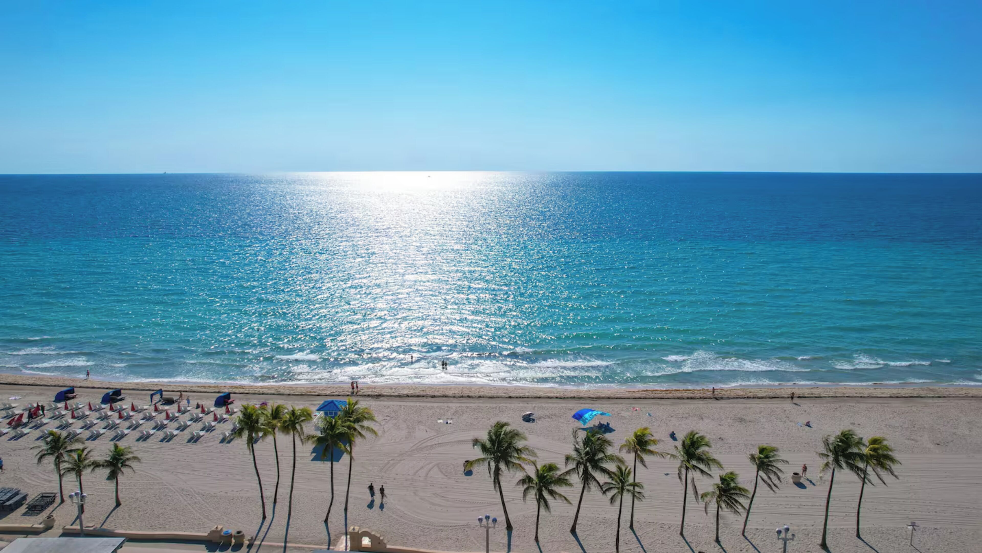 On the beach, sun-loungers, beach towels
