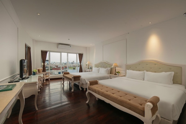 Deluxe Quadruple Room, City View | Soundproofing, free WiFi, bed sheets