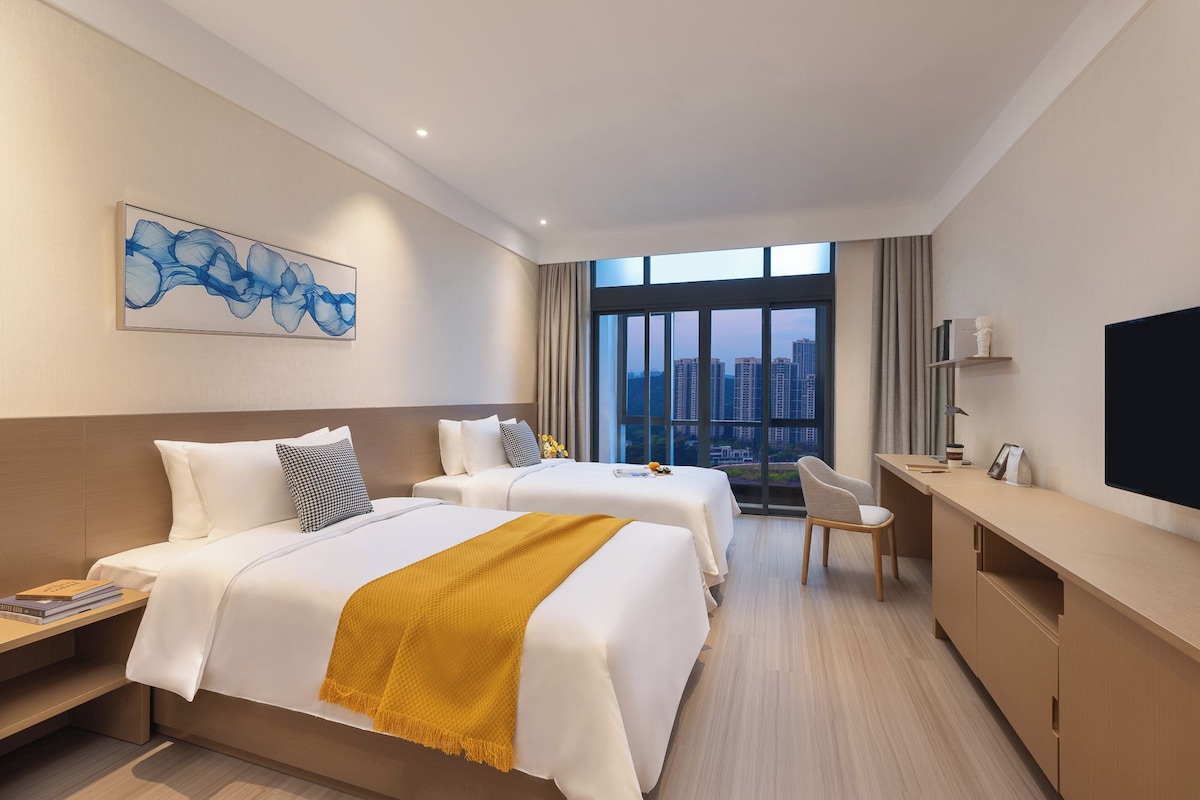 Premium bedding, down duvets, desk, laptop workspace