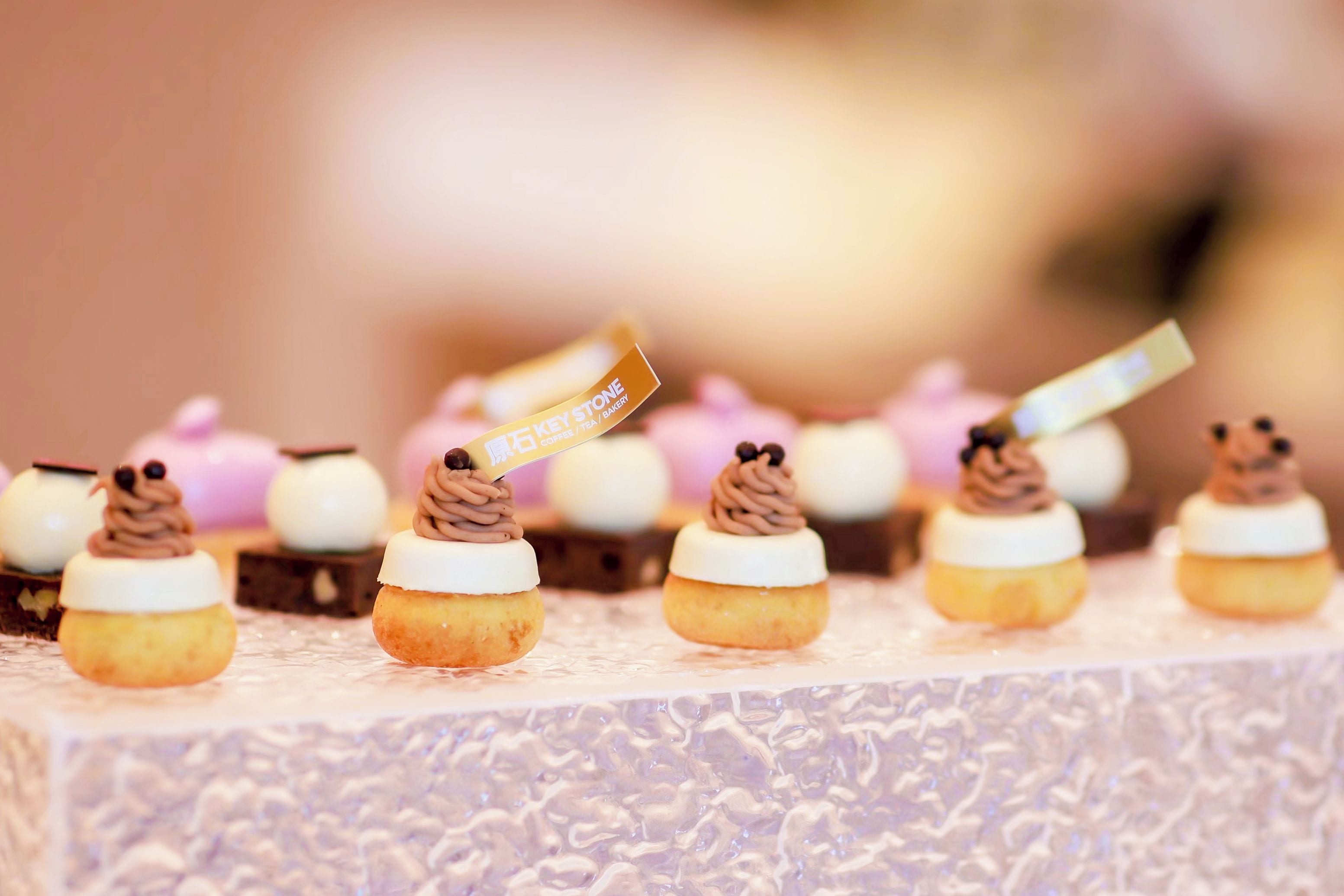 A selection of desserts on a table with a blurred background.