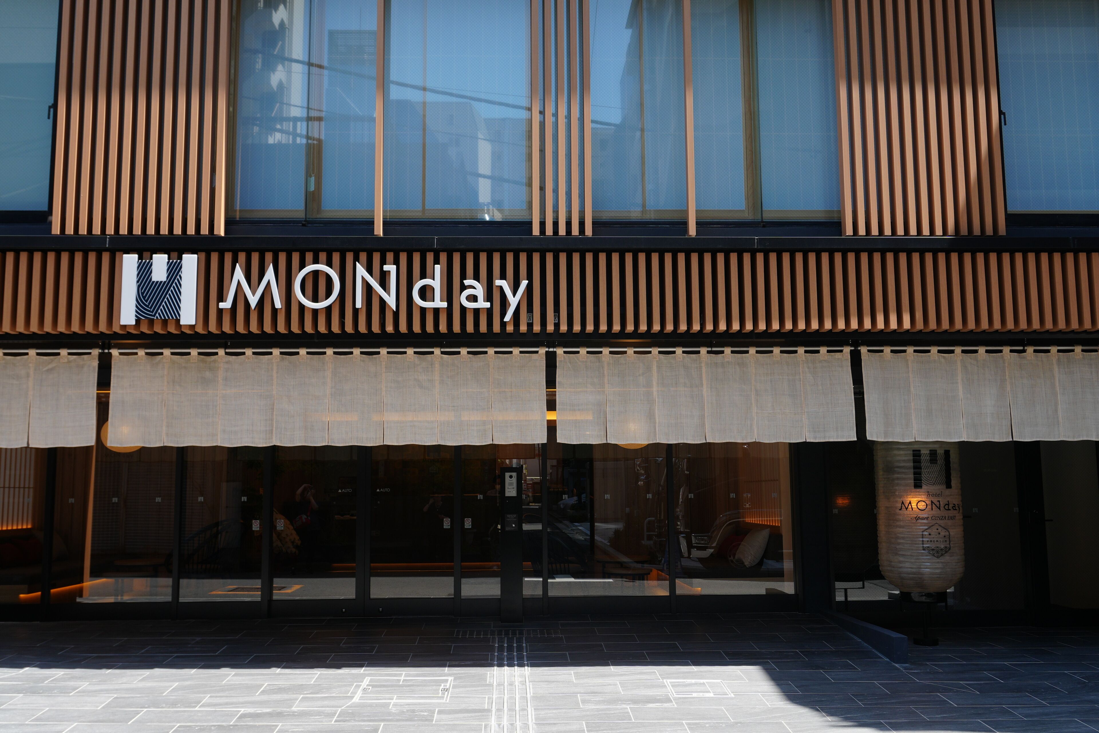 A building with a large sign reading "MONday" above the entrance.