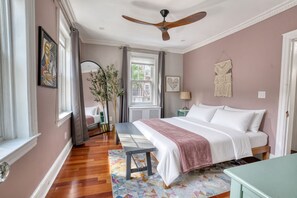 A bedroom with a bed, bedside table, and a ceiling fan. - 4BR near Prospect Park | Off-Street Parking | Outdoor Space | 3 Kings, 1 Queen (Brooklyn)