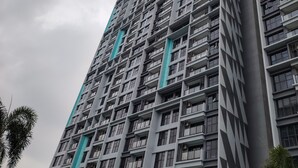 A high-rise building with multiple floors, featuring a grid-like facade with evenly spaced windows and balconies. - Trion KL Residence by Sleepy Owl Suites (Kuala Lumpur)