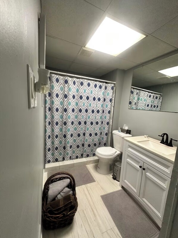 Shower, hair dryer, towels, soap