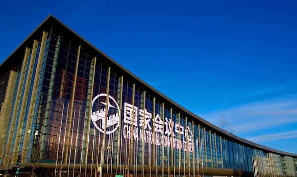 A modern building with a prominent logo and signage indicating it is the National Convention Center.