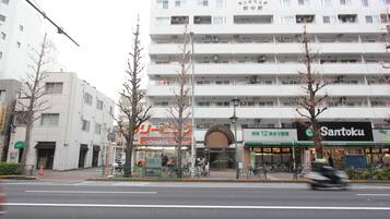A multi-story building with a storefront labeled "Santoku."