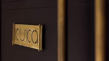 A door with a nameplate reading "KUCO".