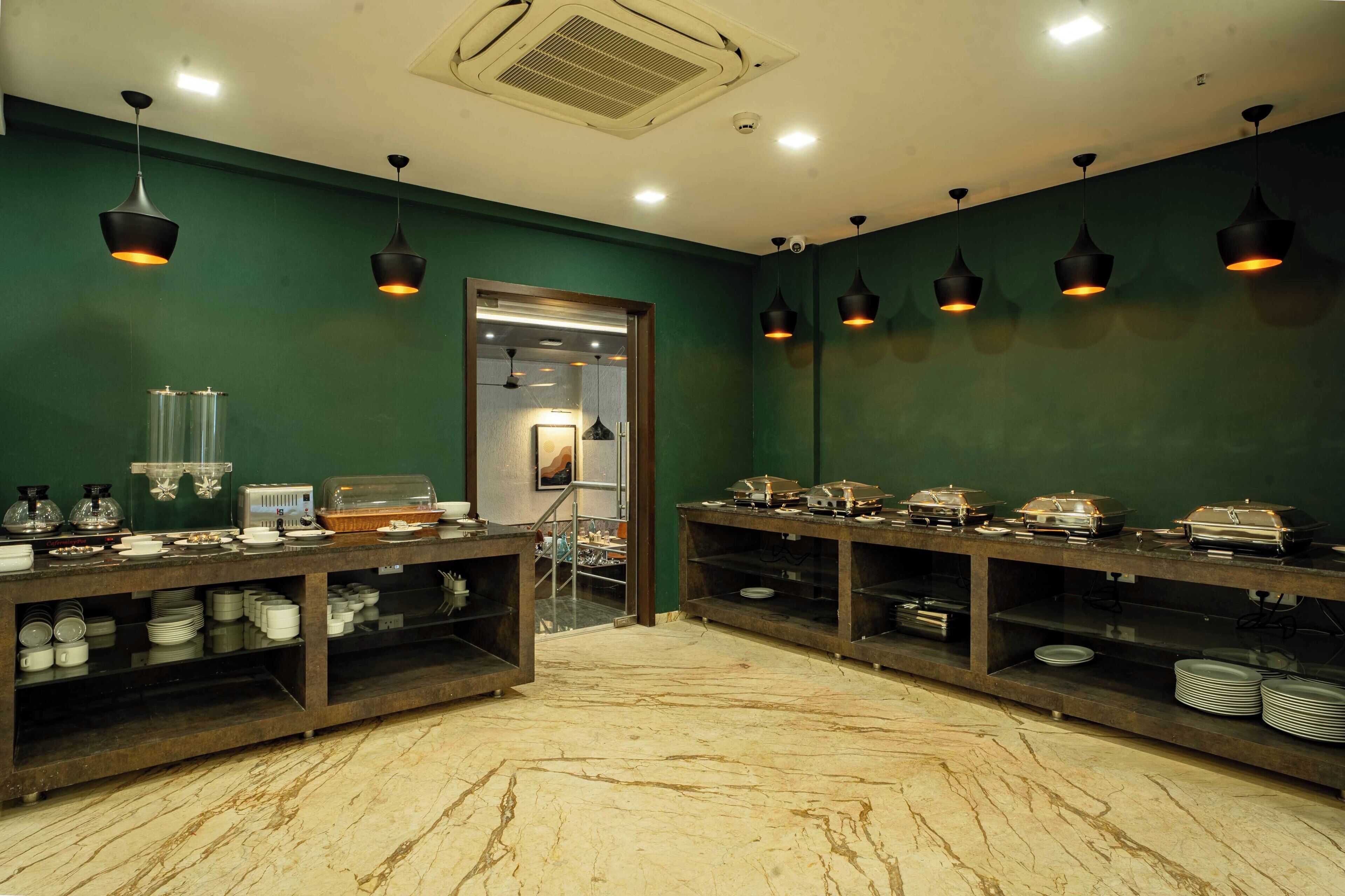 A buffet area with multiple serving stations, each with a variety of dishes and utensils.