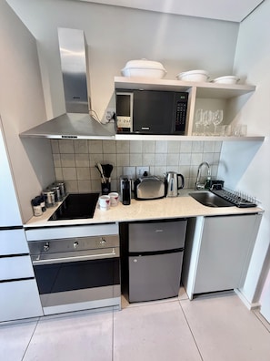 Mini-fridge, microwave, oven, stovetop