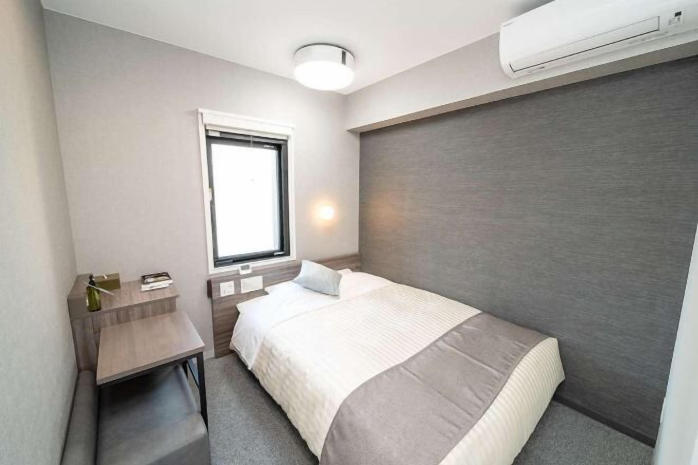 Down duvets, desk, laptop workspace, iron/ironing board