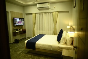 Junior Suite, City View | In-room safe, desk, laptop workspace, blackout curtains - Purple Orchid Hotel (Samaguri)
