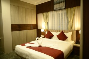 Family Suite, City View | Bathroom | Shower, hair dryer, slippers, towels - Purple Orchid Hotel (Samaguri)