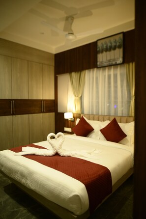 Family Suite, City View | In-room safe, desk, laptop workspace, blackout curtains - Purple Orchid Hotel (Samaguri)