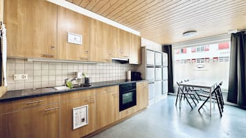 Mini-fridge, microwave, stovetop, cookware/dishes/utensils