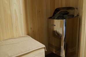 A sauna with a wooden interior and a metallic door. - GOKAN KOTOHIRA (Kotohira)
