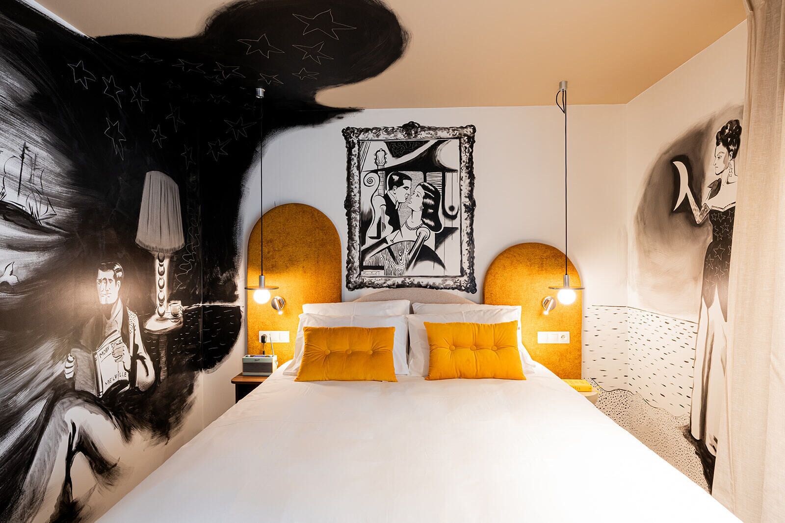 A bedroom with a large bed, two bedside tables, a wall-mounted artwork, and a unique ceiling design.