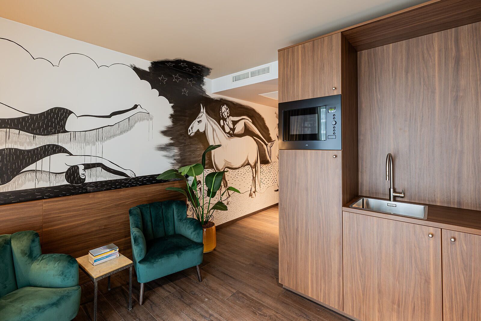 A modern kitchen with wooden cabinets, a built-in microwave, and a sink.