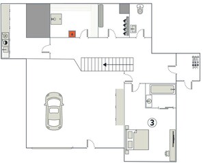 Ein Hotelgrundriss mit Parkplatz, einem Zimmer mit Bett, einem Badezimmer und einer Küchenzeile.