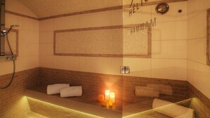 A bathroom with a bathtub, a shower, and a towel rack.