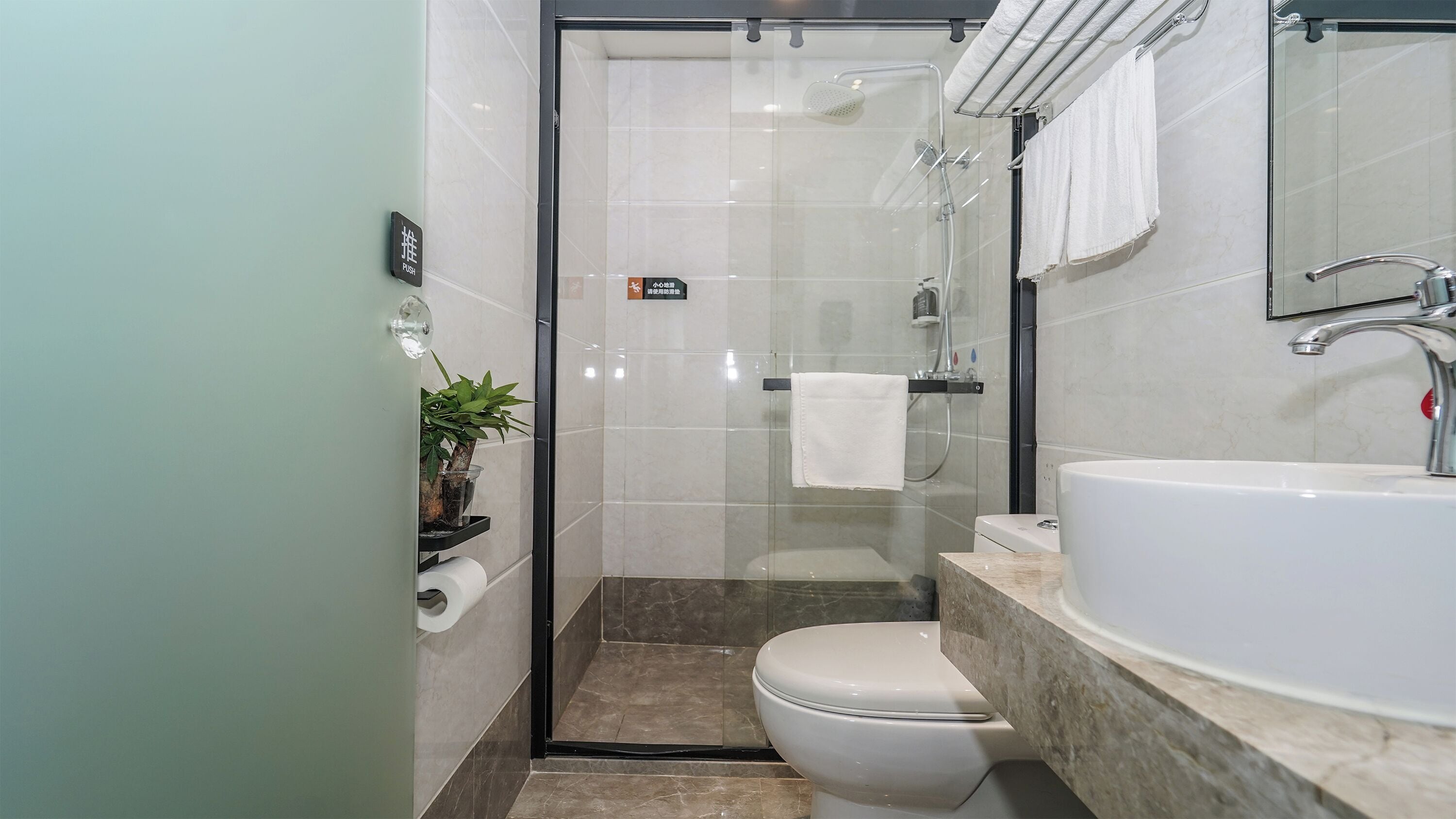 Shower, hair dryer, slippers, towels
