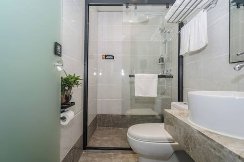 Shower, hair dryer, slippers, towels
