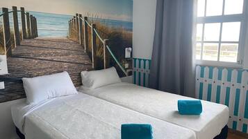 Habitación con 1 cama matrimonial o 2 individuales, vista a la playa | Wifi gratis