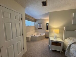 Shower, jetted bath, towels