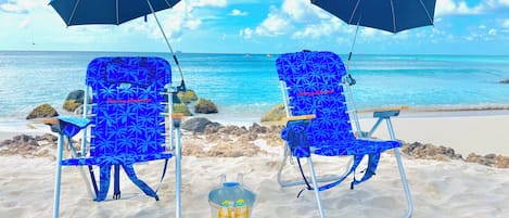 On the beach, sun loungers, beach towels