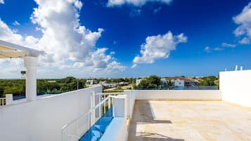 Enjoy a refreshing dip in the pool on this rooftop oasis with stunning views of the surrounding cityscape.