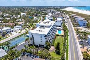 Enjoy beach access and a rooftop pool at this coastal hotel, featuring a tennis court and lush lawn area.