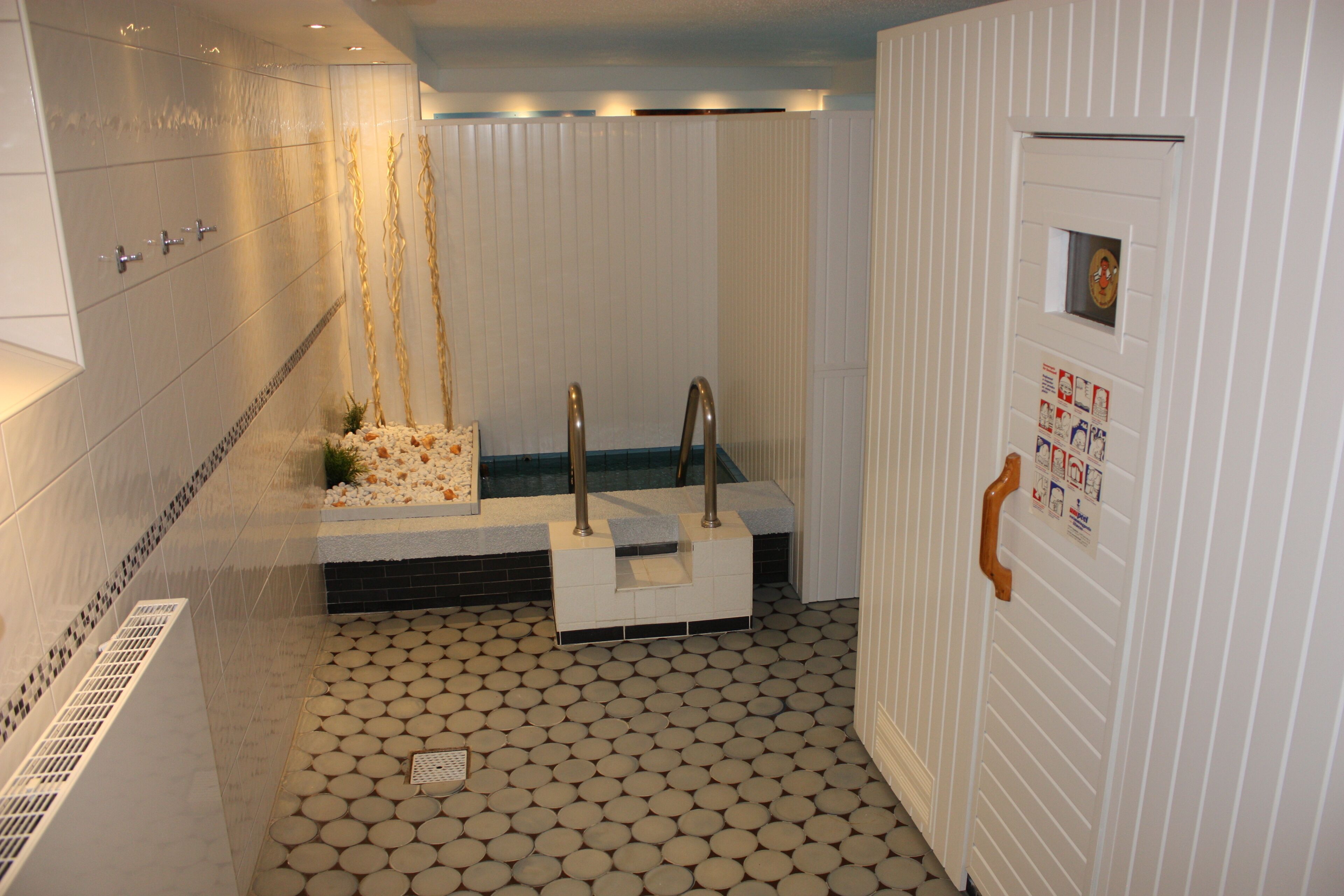 A bathroom with a bathtub, a shower, and a toilet.
