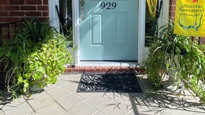 A front door with the number 929, a wreath, and a yellow banner. - Masters Tournament Rental; 4 Bed, 2.5 Bath-4 Bedroom Home in Heart of Evans, GA (Evans)