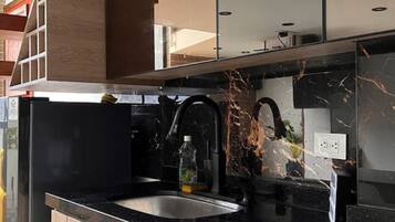 Microwave, coffee/tea maker, cookware/dishes/utensils, dining tables