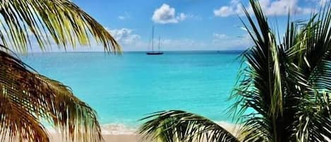 On the beach, sun loungers, beach towels