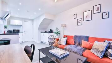 Comfort Apartment, 2 Bedrooms, City View | Living area | 42-inch Smart TV with digital channels